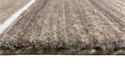 Gabbeh rug close-up of the edge: high pile, beige and brown with stripes