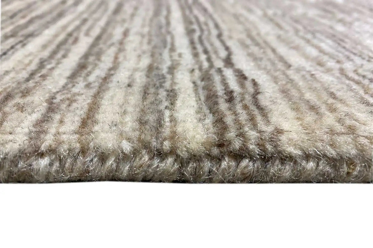 Rug detail: dense pile with light beige and brown-gray stripes
