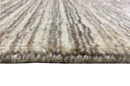 Rug detail: dense pile with light beige and brown-gray stripes