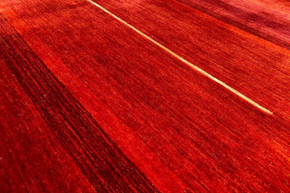 Gabbeh rug with fine, light lines and dark color stripes in red, detail