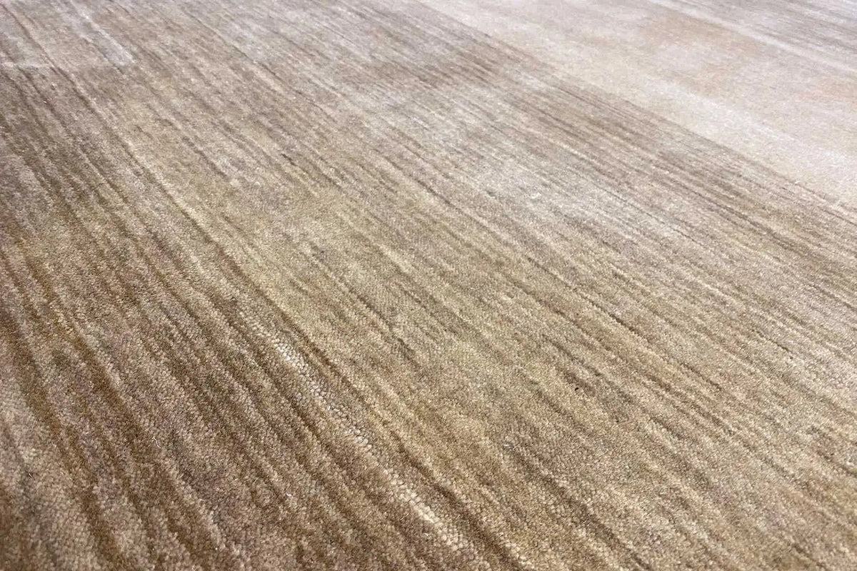 Gabbeh rug (200x139 cm) close-up of the surface: light lines, beige-brown tone