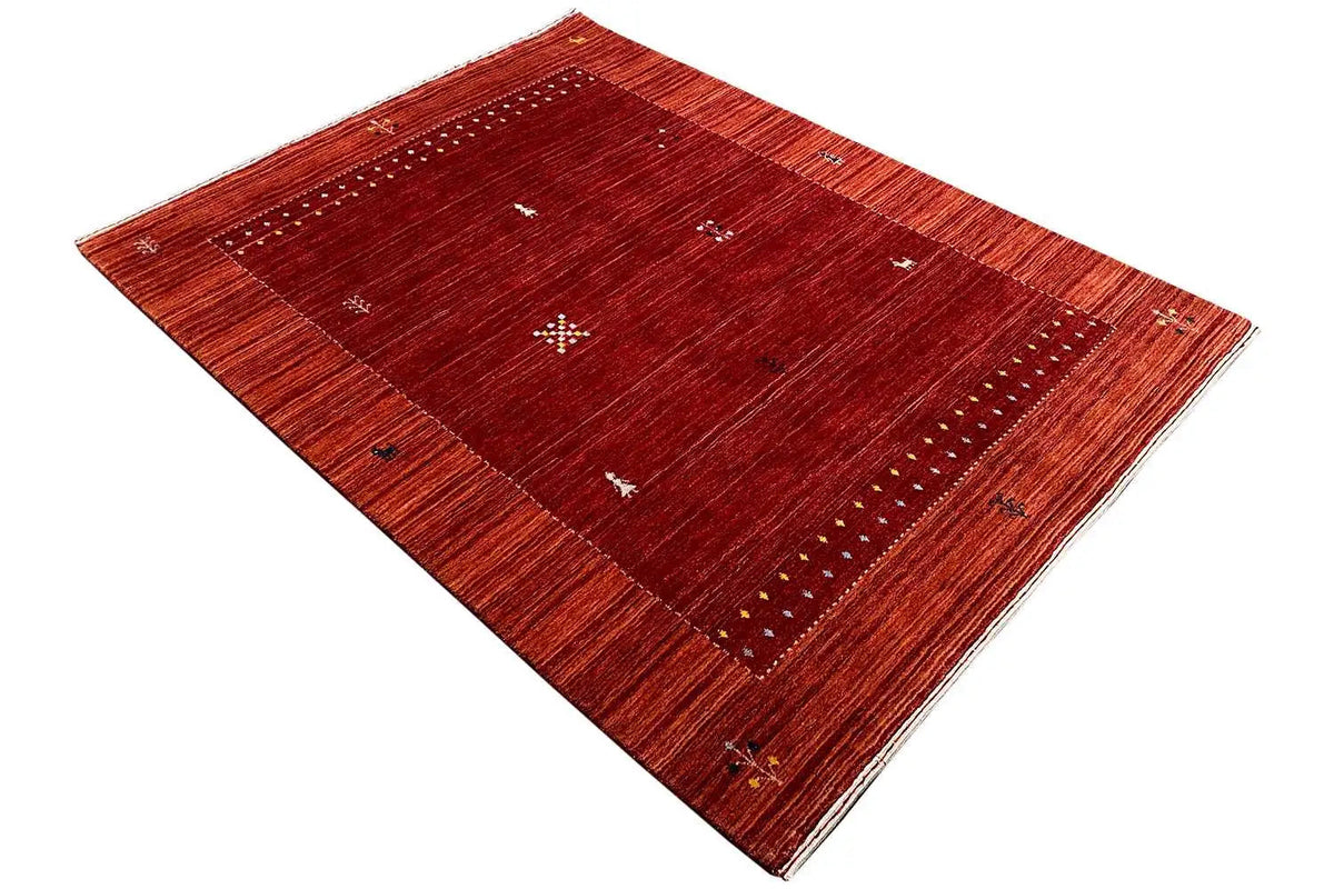 Gabbeh rug, reddish-brown border and central field with dot motifs