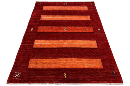 Gabbeh rug, broadly textured pile in red with several orange rectangular stripes
