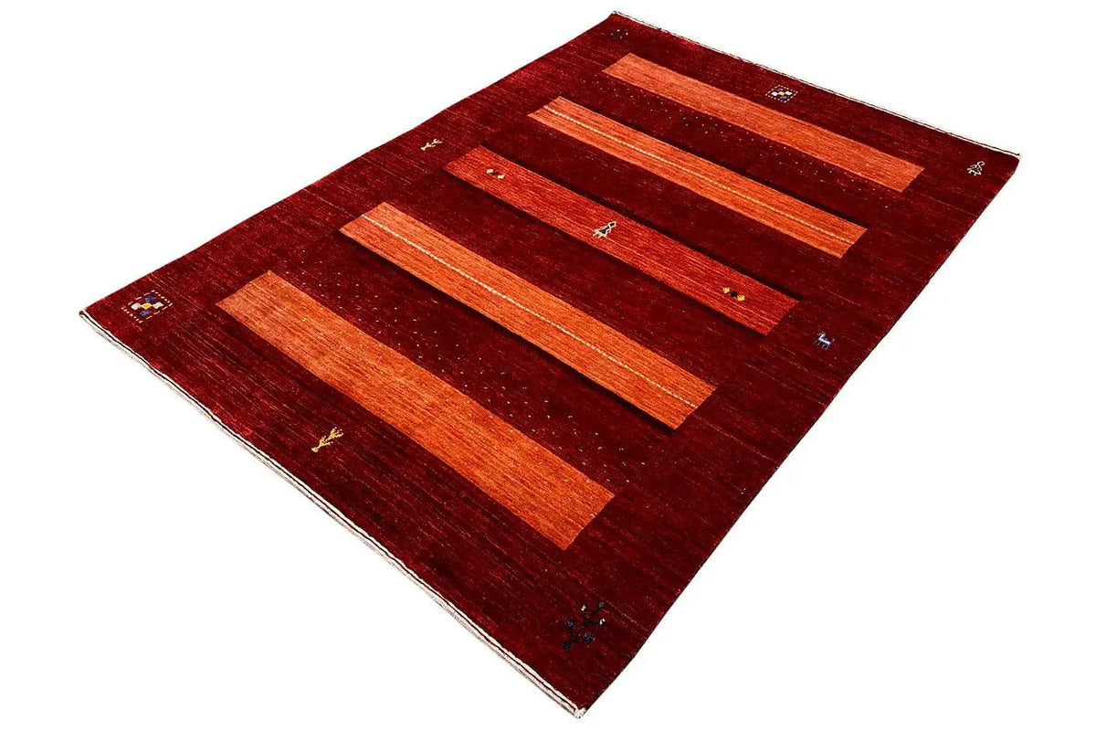 Gabbeh rug in reddish brown with orange stripes and small decorative motifs along the edges