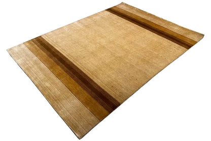 Rug viewed from an angled perspective: beige background, brown longitudinal and transverse stripes