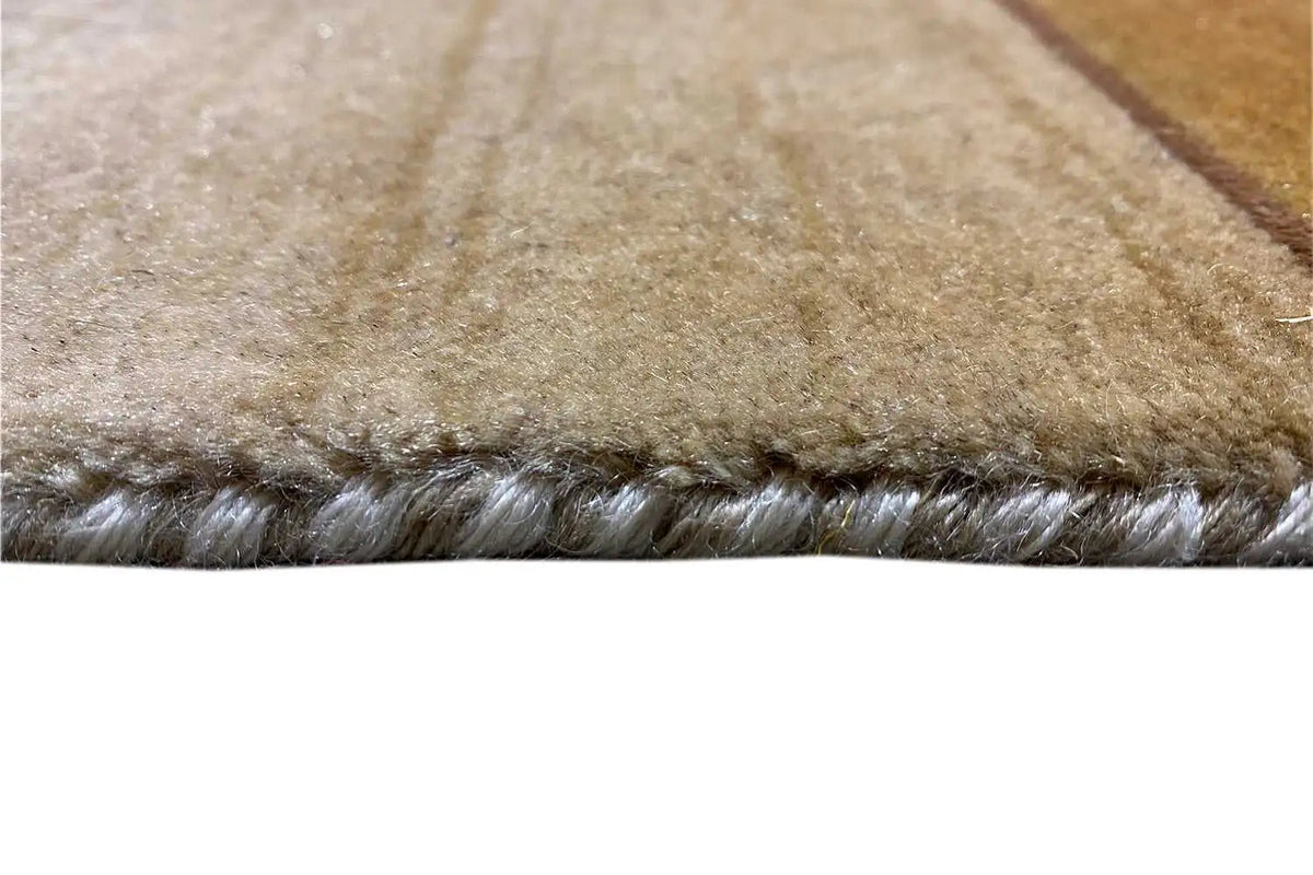 Detailed view: beige pile with a dense edge and brown fiber areas
