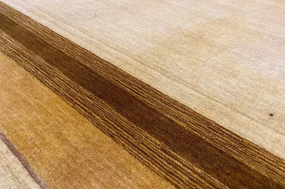 Carpet surface with a beige base and long brown stripes, tightly cropped