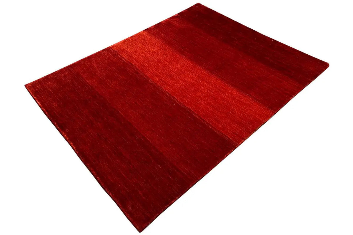 Gabbeh rug, red, appearing square, diagonal view with the wide side