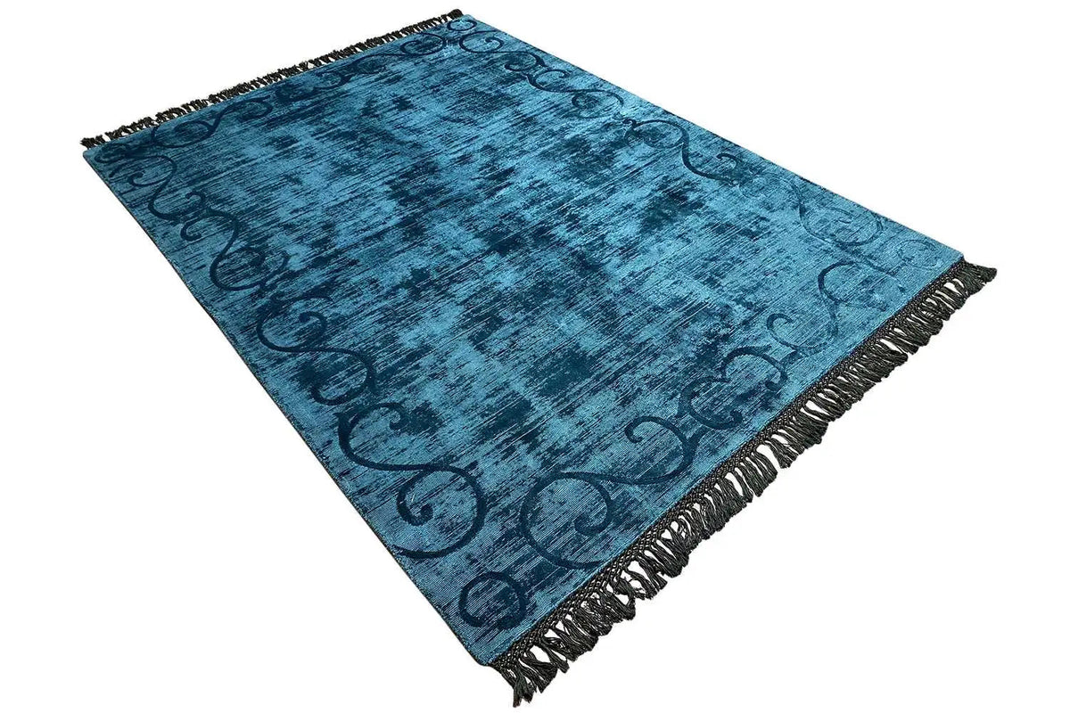 Blue Gabbeh rug with fringes along the edges, ornamental pattern in a diagonal design