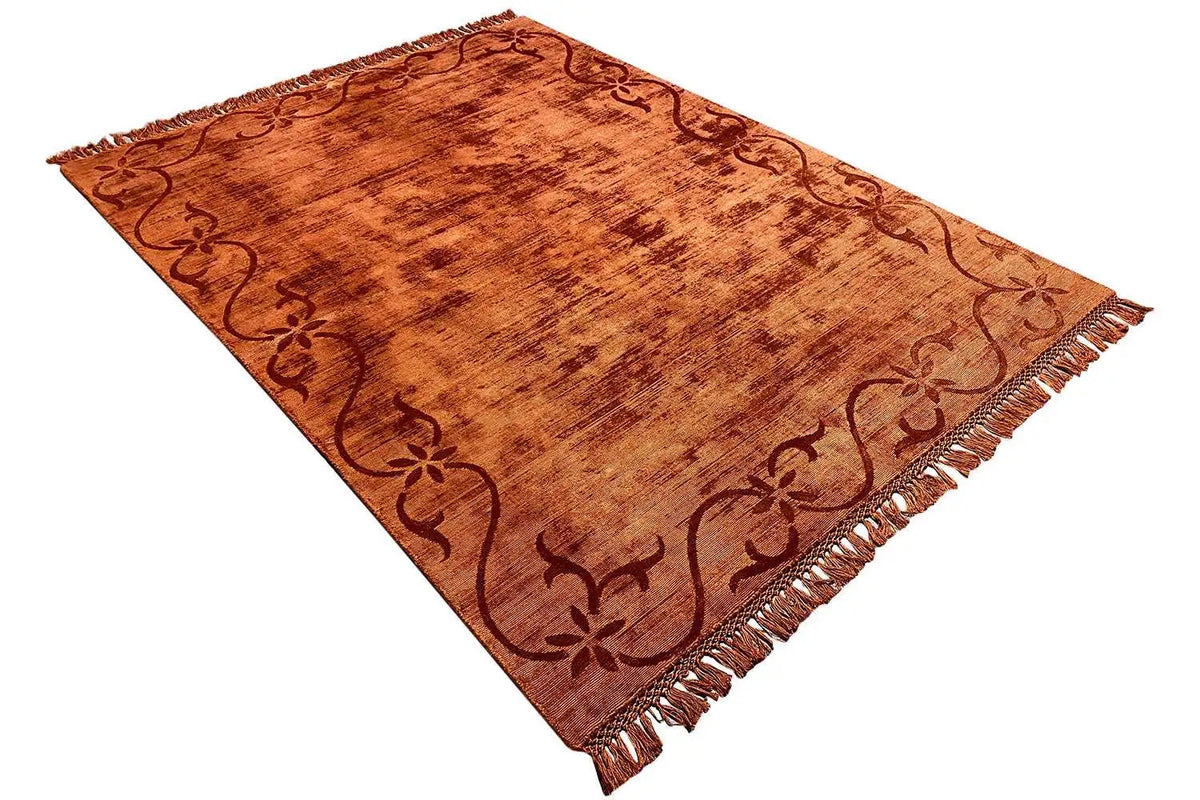 Gabbeh rug 238x174 cm, rust-brown surface with a vine pattern, laid at an angle