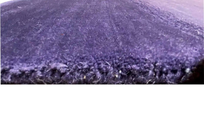Gabbeh rug close-up: pile and edge with a fine fringed finish, purple.