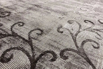 Gabbeh rug detail: gray woven texture with dark vine ornaments