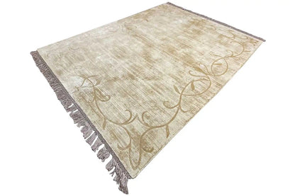 Gabbeh rug, cream-colored woven fabric with vine ornaments, laid diagonally