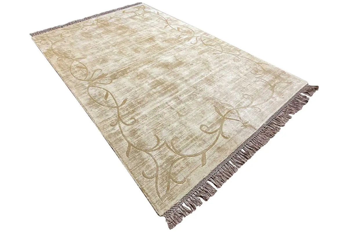 Gabbeh rug, cream-colored pile with a brown vine motif, fringes along the edges