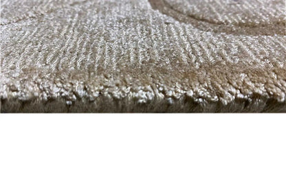 Gabbeh rug, close-up of the pile structure and fringes along the edge, cream beige