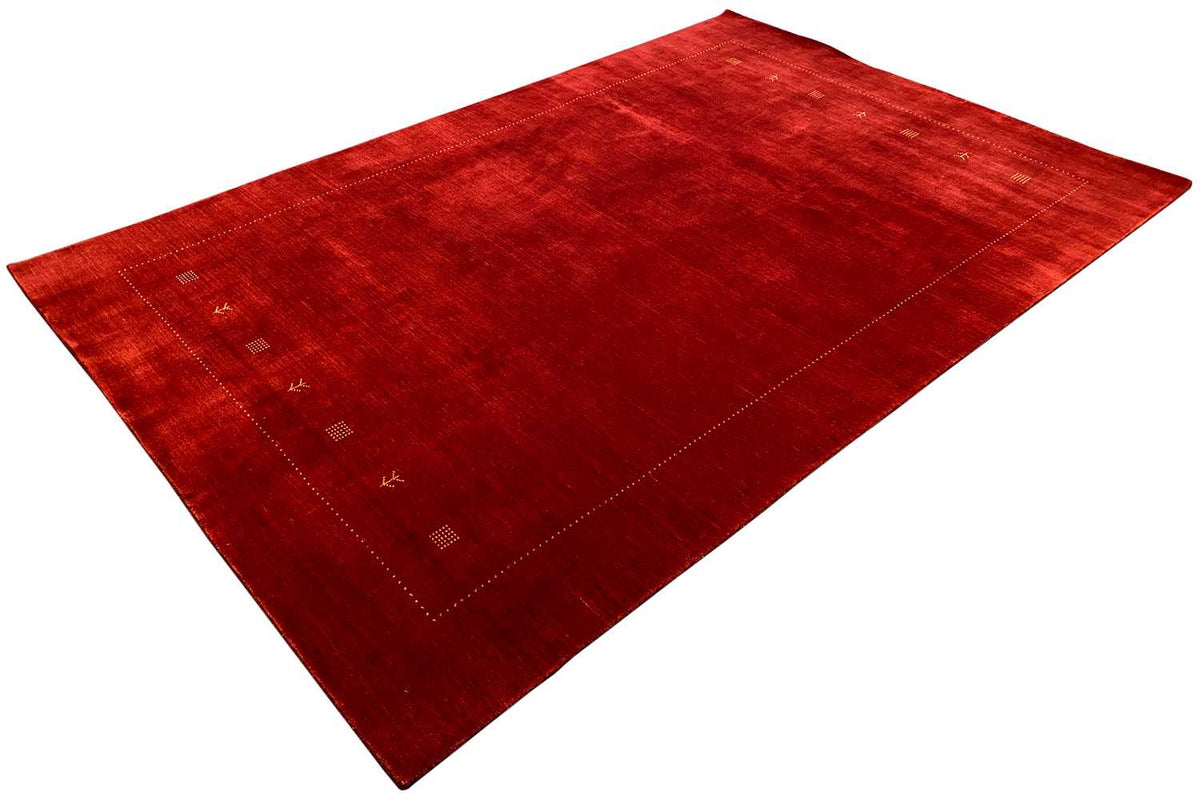 Red Gabbeh rug with clean lines and subtle square ornamentation