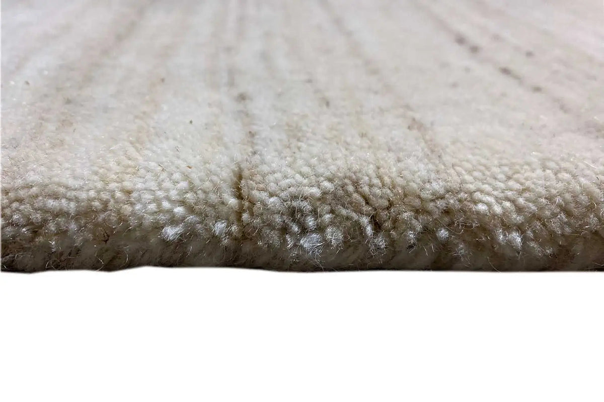 Close-up: beige carpet with a soft pile and dense fiber structure