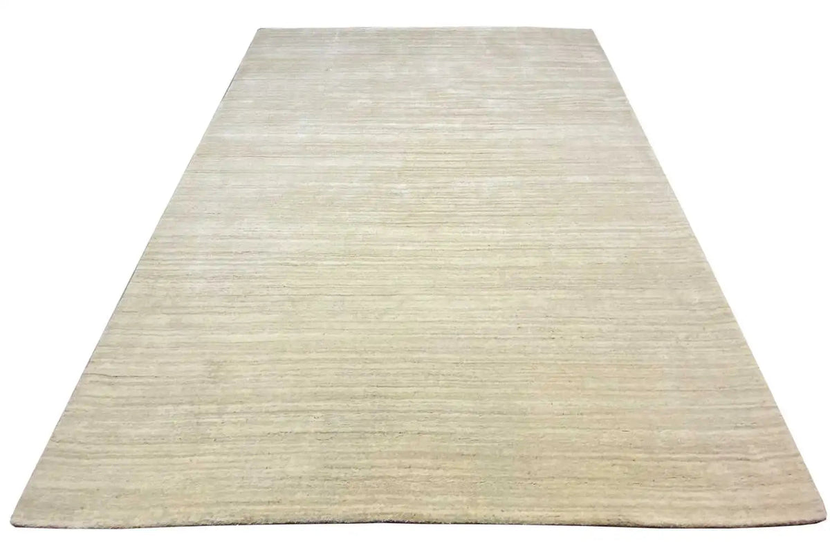 Light beige rug, 201x253 cm, laid at an angle with a fine striped texture