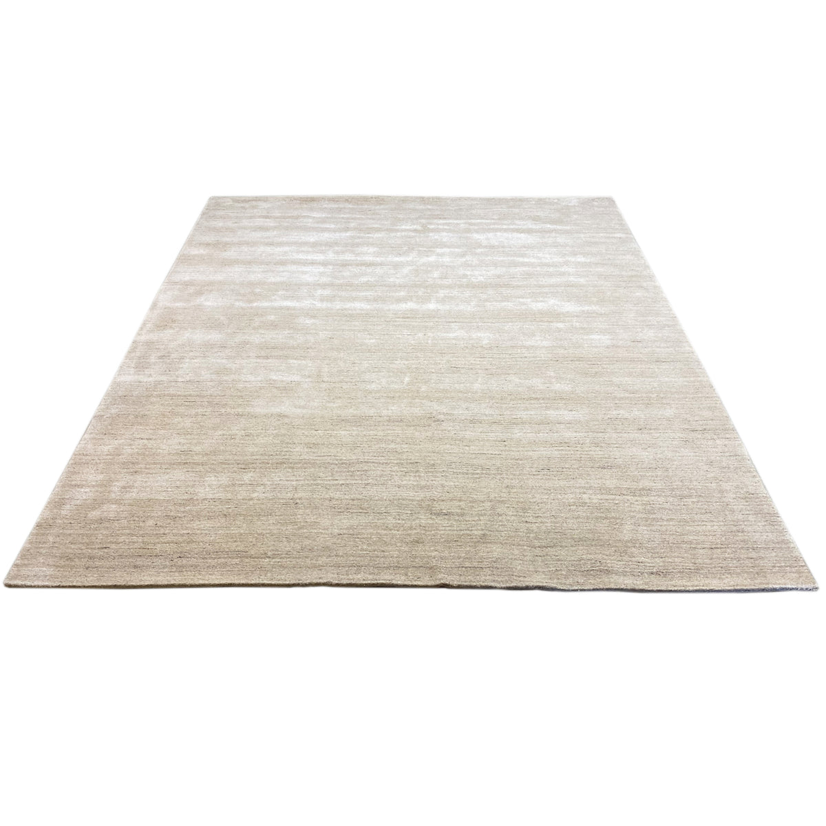 Beige rectangular rug with a fine, light-colored pattern in the pile