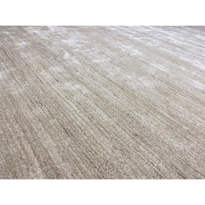 Close-up: beige rug with a fine texture and faded-looking stripes
