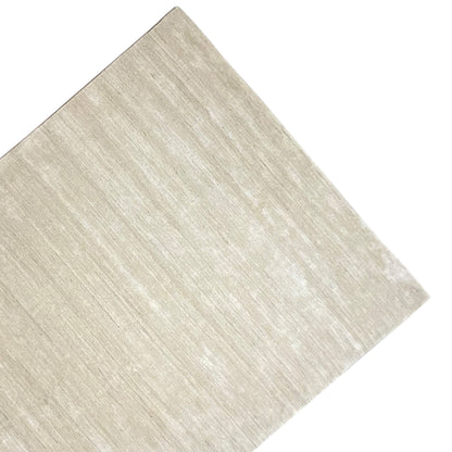 Beige carpet with light lines, photographed diagonally