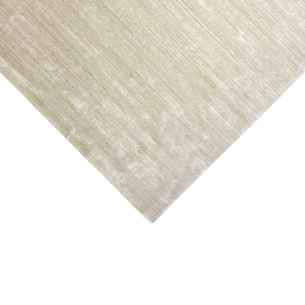 Beige carpet corner with an even surface and a delicate, light-colored pattern