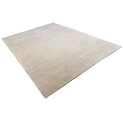 Beige carpet with clean edges, diagonal view of the textured surface