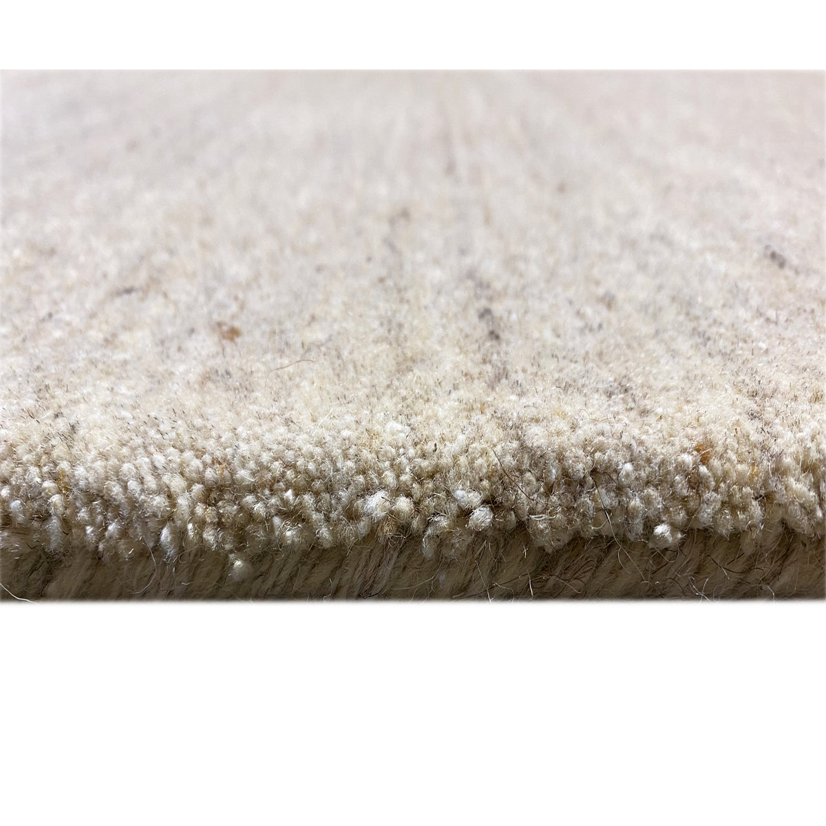 Carpet edge with a short pile: beige, dense pile on the underside