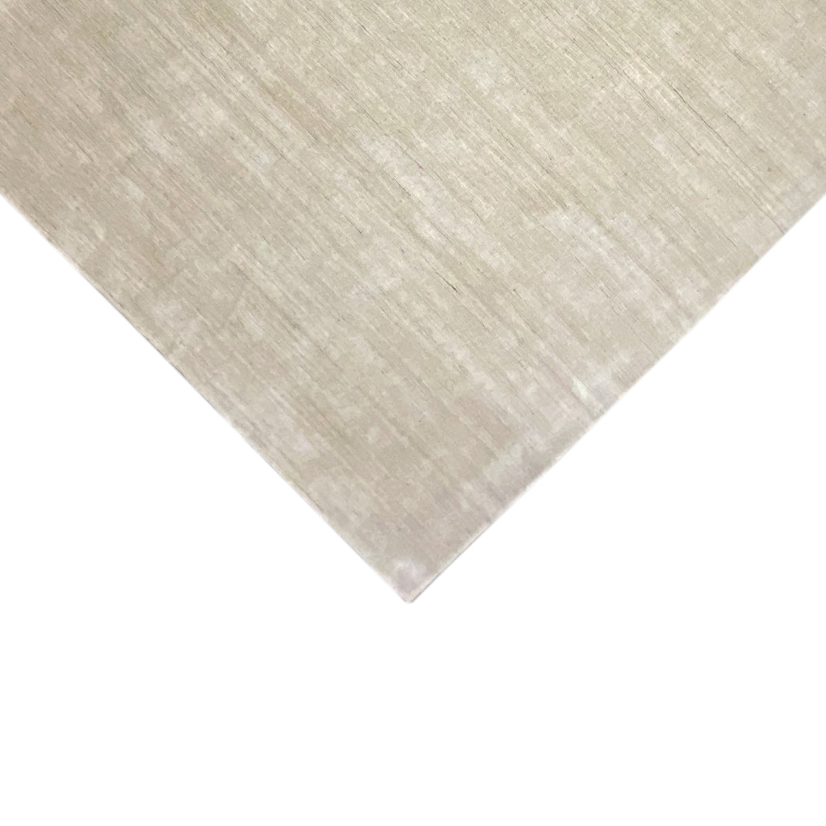 Beige diagonal rug: clean shape, matte surface with a fine, gridded texture