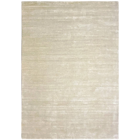 Beige rectangular rug with a fine, matte surface texture