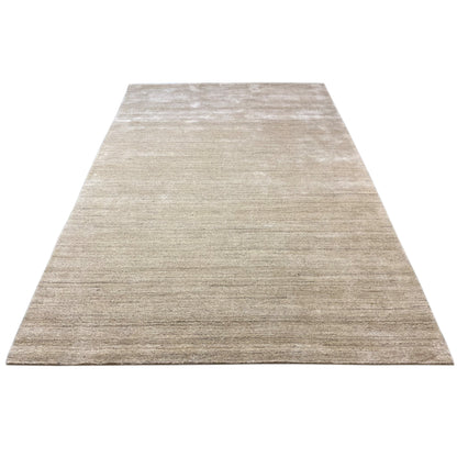 Rectangular low-pile rug in light beige with a uniform surface appearance