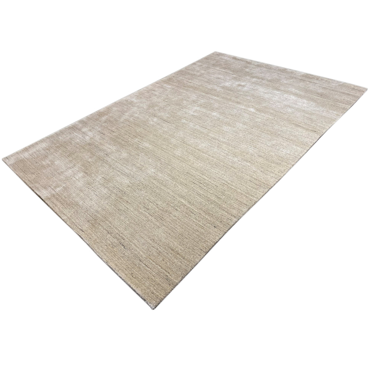 Beige short-pile rug, rectangular, positioned diagonally with a delicate line pattern