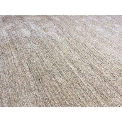 Close-up of the beige carpet: fine, heathered fibers and an even surface