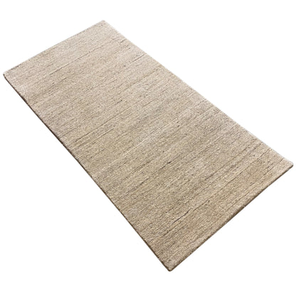 Rectangular rug, light beige mottled pile with a linear relief texture in the weave