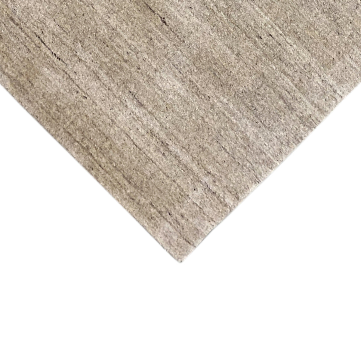Light beige carpet, diagonal view, with a subtle embossed line pattern