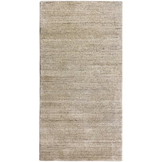 Rectangular rug, beige mottled pile with a subtle linear pattern