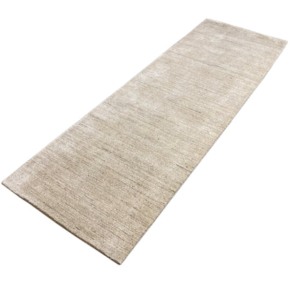 Rectangular rug, beige mottled, elongated shape with straight edges
