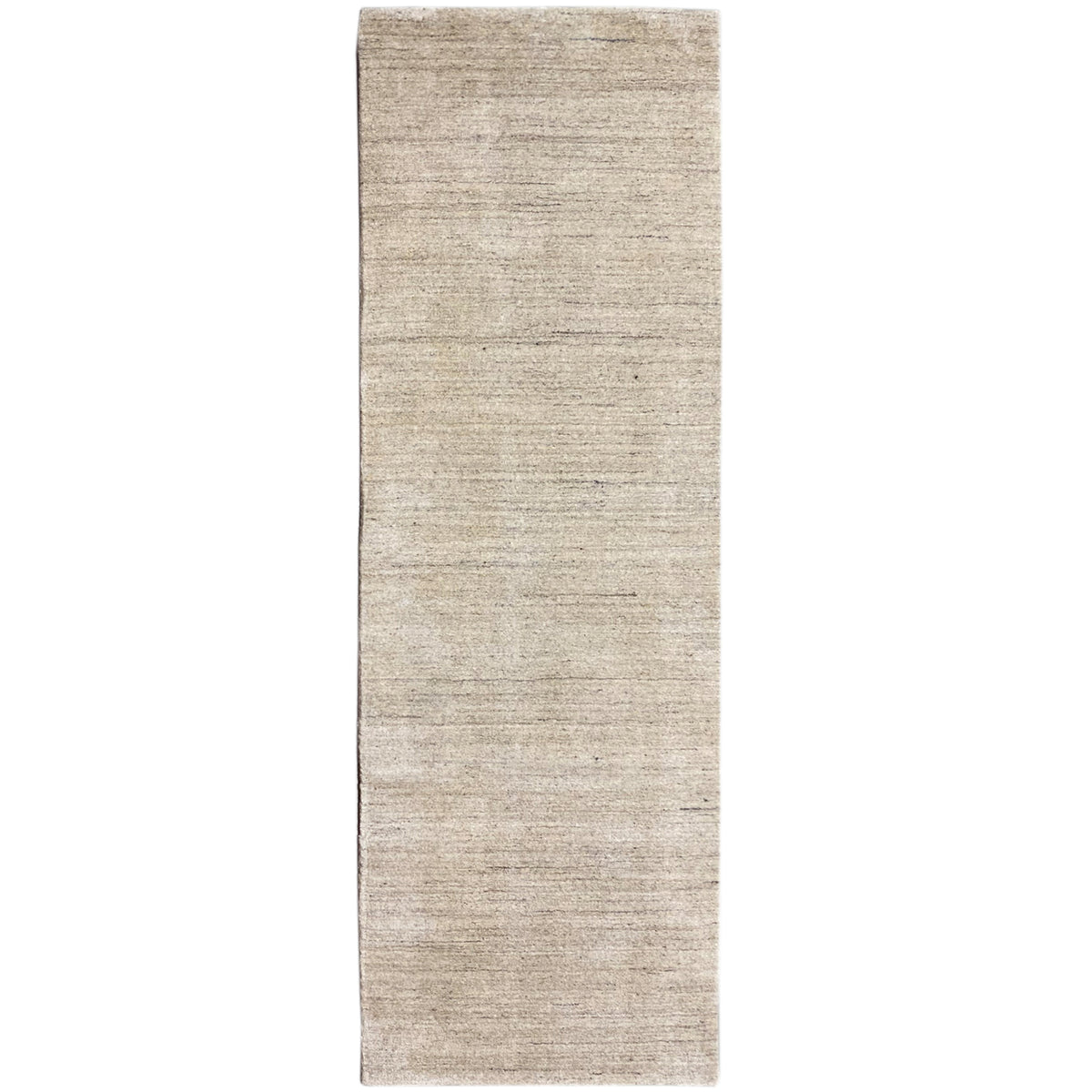 Narrow rectangular rug, mottled beige, right edge visible