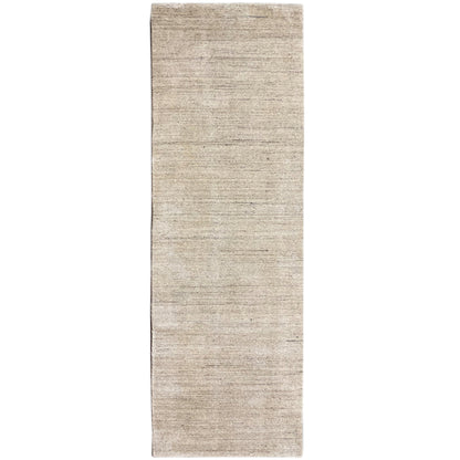 Narrow rectangular rug, mottled beige, right edge visible