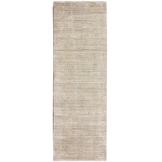 Narrow rectangular rug, mottled beige, right edge visible