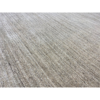 Close-up of the carpet surface: flat weave with fine beige and gray stripes