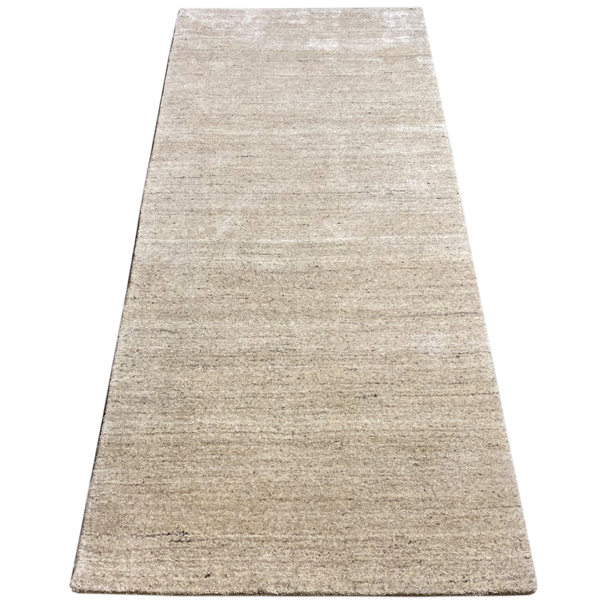 Beige rug with a narrow woven pattern, rectangular surface, clean border