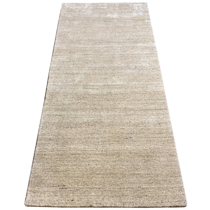 Beige rug with a narrow woven pattern, rectangular surface, clean border