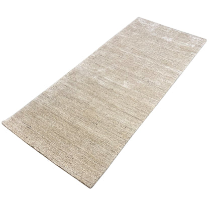 Beige carpet shown in a wide view, with an even woven texture and fine lines
