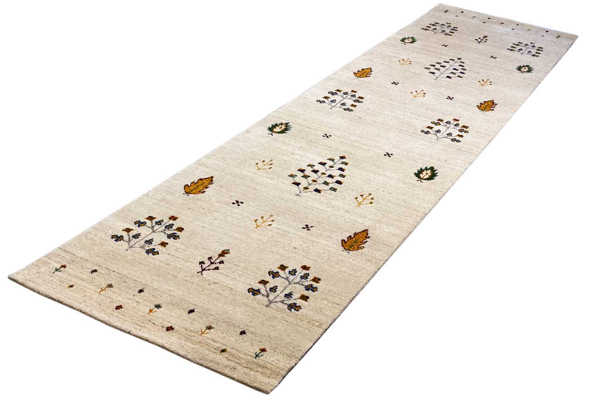 Gabbeh runner diagonal: beige background with colorful floral and tree motifs