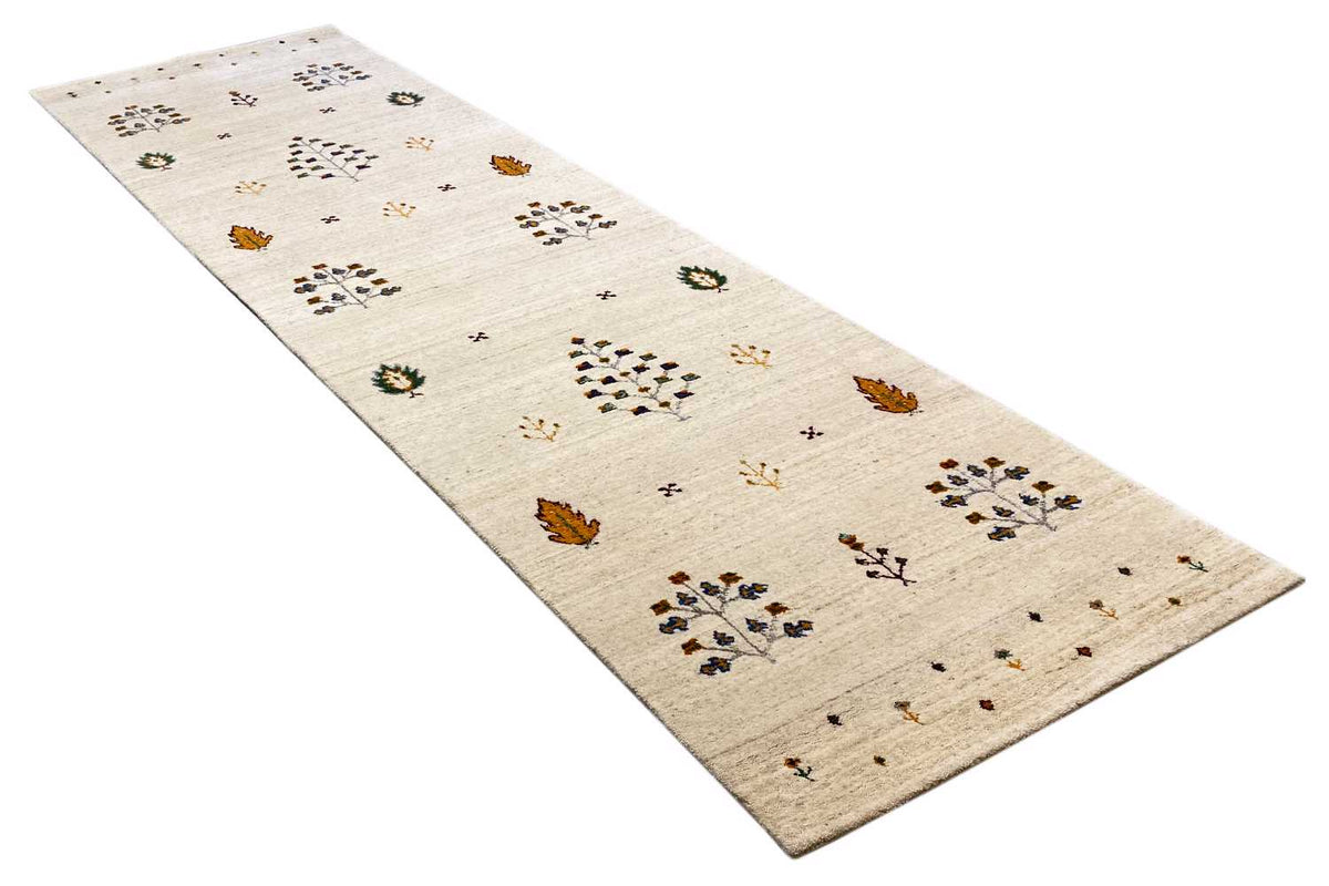 Gabbeh runner at an angle: beige background with colorful patterned blocks and dots