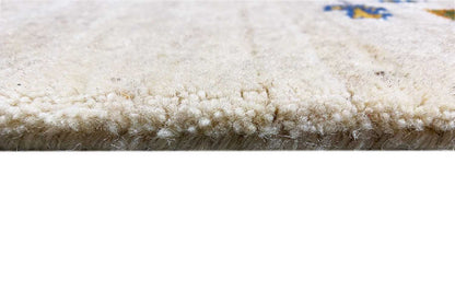Close-up of Gabbeh runner: dense pile and fringed border, beige tone