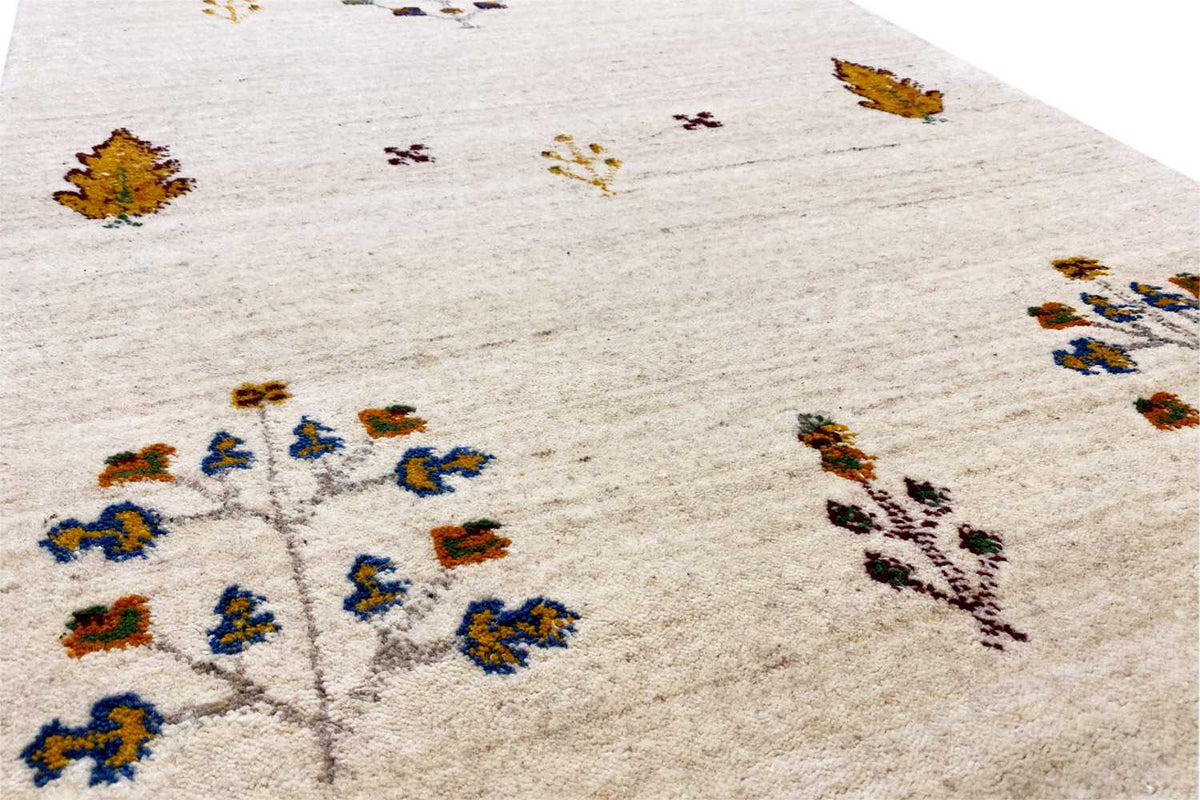 Gabbeh runner, cream-colored pile with colorful cross and floral patterns