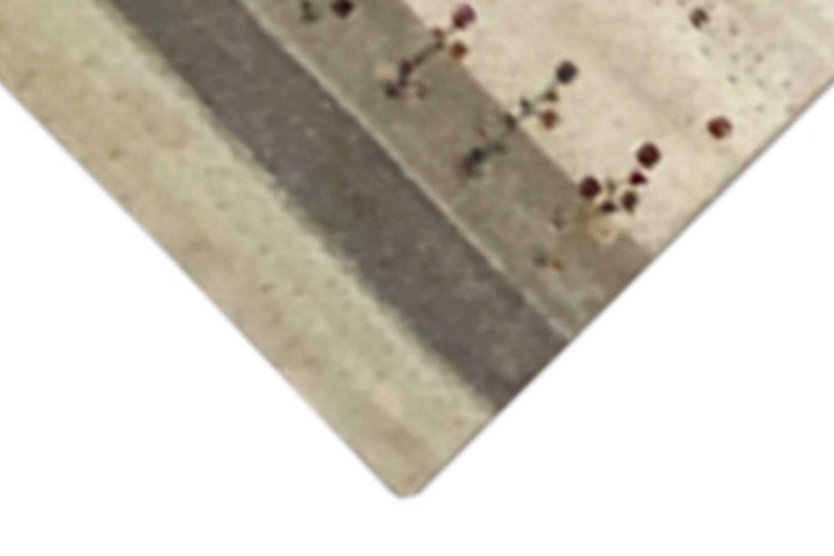 Corner of a beige runner with a gray border stripe and colorful cross motifs