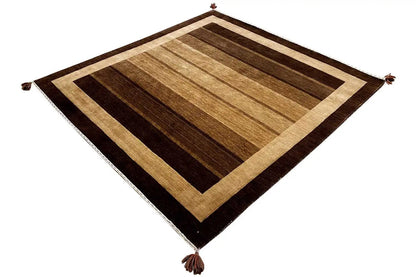 Gabbeh rug with a rectangular diamond pattern, brown-beige block stripes, corner fringes.